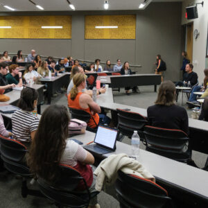 Auditorium of people watching a panel discussion